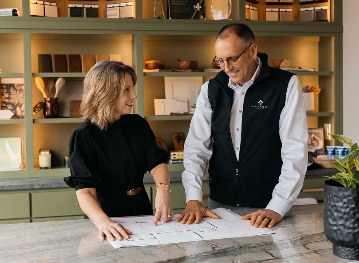 VanderBeken Team looking at floorplans