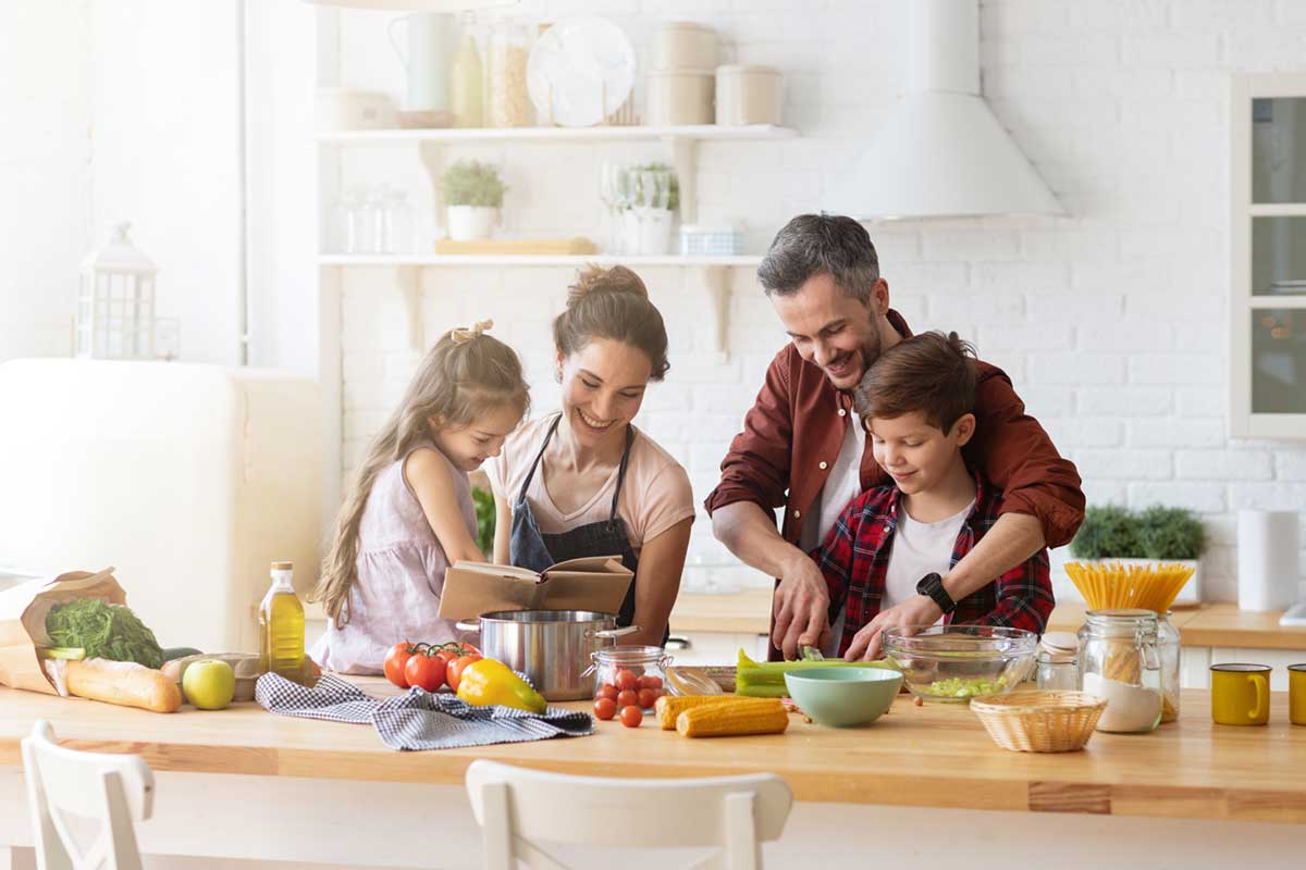 Family cooking together in kitchen