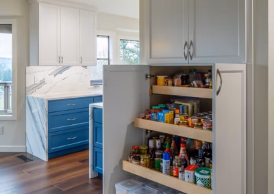 Modern Blue Kitchen Remodel with Statement Waterfall Countertop in Snohomish, WA