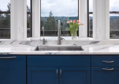 Modern Blue Kitchen Remodel with Statement Waterfall Countertop in Snohomish, WA