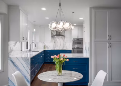 Modern Blue Kitchen Remodel with Statement Waterfall Countertop in Snohomish, WA
