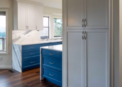 Modern Blue Kitchen Remodel with Statement Waterfall Countertop in Snohomish, WA