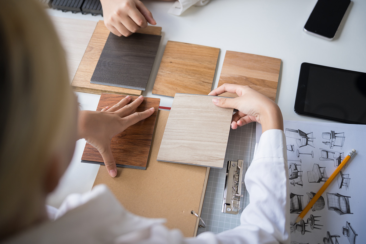 agent and client looking at flooring designs